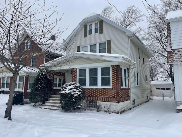 view of front of home featuring a garage and an outdoor structure