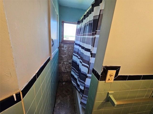 520 E 2nd St, Erie, PA 16507 - hallway featuring tile walls and wainscoting