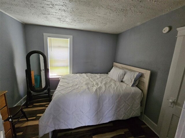 520 E 2nd St, Erie, PA 16507 - bedroom featuring wood finished floors and a textured ceiling