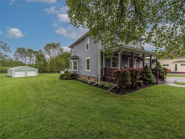 817 E Main St, Corry, PA 16407 - view of home's exterior with a garage, an outdoor structure, a yard, and a porch