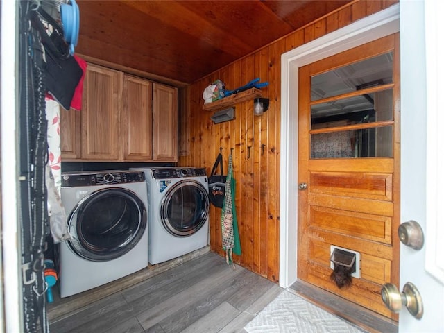 817 E Main St, Corry, PA 16407 - laundry room with independent washer and dryer, cabinet space, wood ceiling, wood walls, and wood finished floors