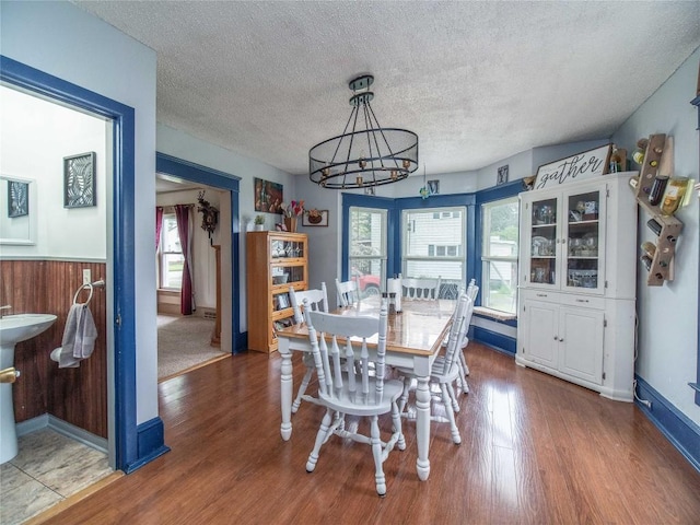 817 E Main St, Corry, PA 16407 - dining room featuring a chandelier, wood finished floors, and a textured ceiling