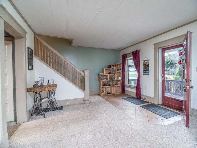 817 E Main St, Corry, PA 16407 - foyer entrance with carpet floors, tile patterned floors, stairs, and ornamental molding