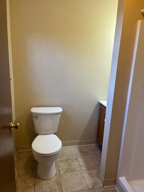 bathroom featuring a shower, vanity, and toilet