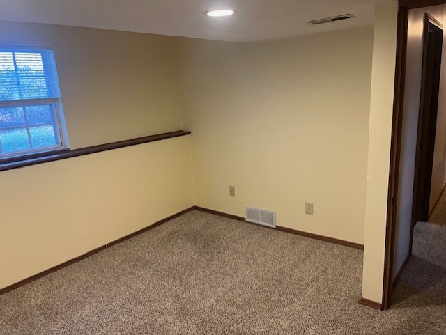 empty room featuring carpet flooring