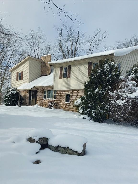 view of snow covered house