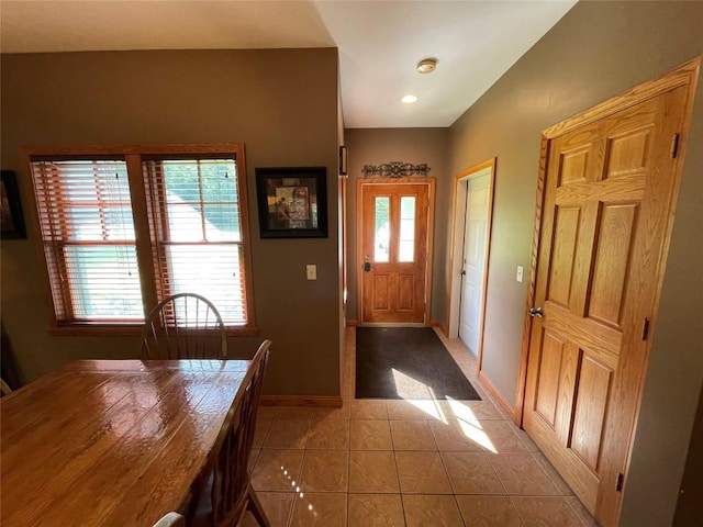 doorway featuring light tile patterned flooring