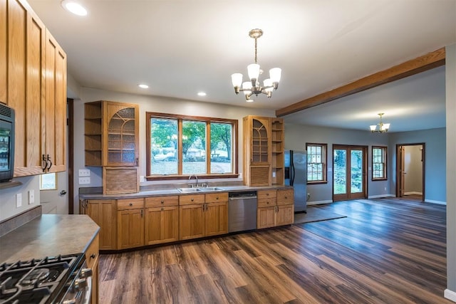 kitchen with sink, an inviting chandelier, pendant lighting, and appliances with stainless steel finishes