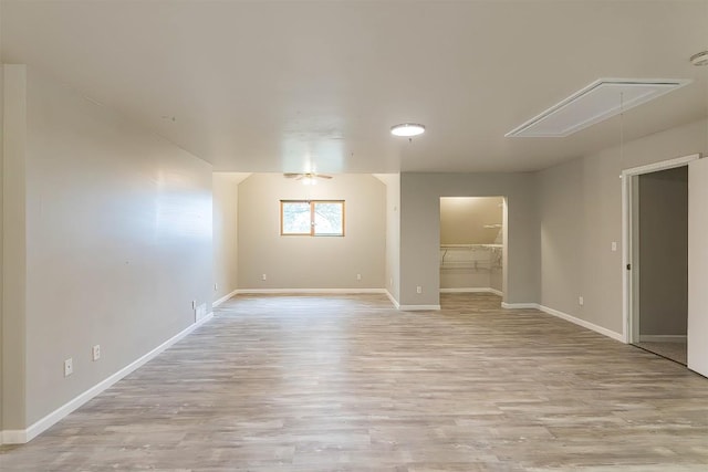 spare room with ceiling fan and light hardwood / wood-style flooring