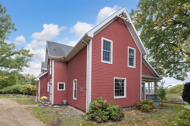 view of home's exterior featuring a sunroom