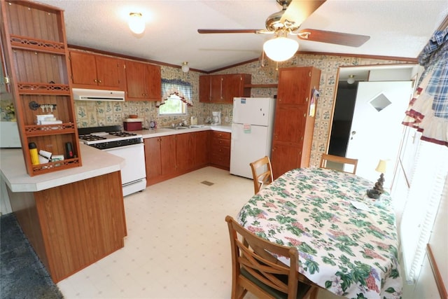 22080 Merganser Ln, Cochranton, PA 16314 - kitchen featuring white appliances, lofted ceiling, a sink, brown cabinetry, and extractor fan
