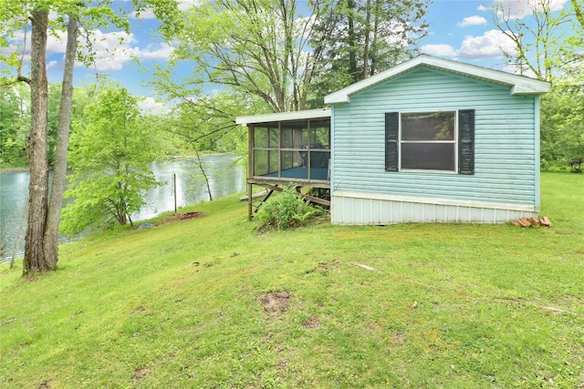 22080 Merganser Ln, Cochranton, PA 16314 - view of grassy yard featuring a water view and a sunroom
