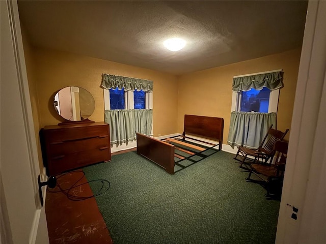 carpeted bedroom featuring a textured ceiling