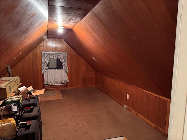 additional living space featuring wooden ceiling, wooden walls, and vaulted ceiling