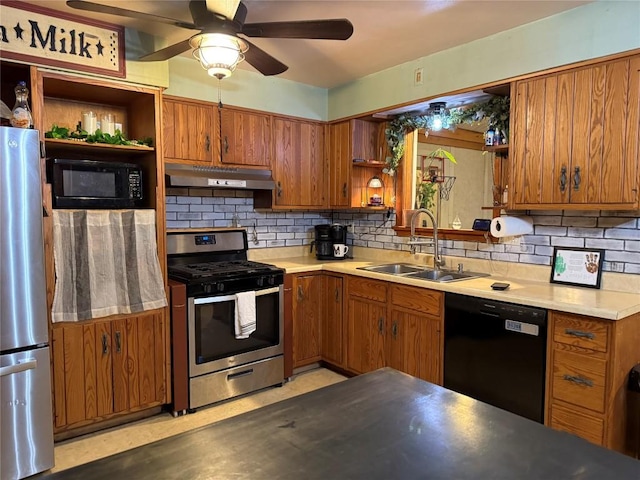 kitchen featuring tasteful backsplash, sink, black appliances, and ceiling fan