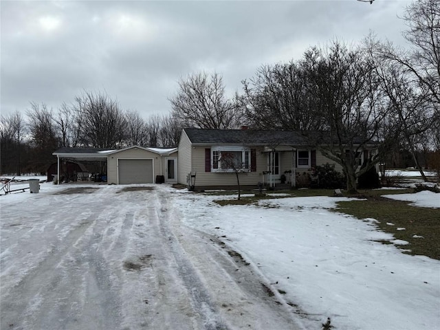 view of front of house with a garage and a carport