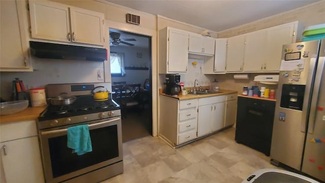 kitchen featuring appliances with stainless steel finishes, white cabinetry, ceiling fan, and sink