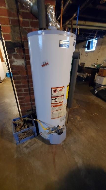 utility room with gas water heater