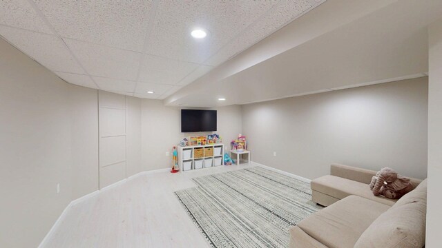 game room with wood finished floors, recessed lighting, and baseboards