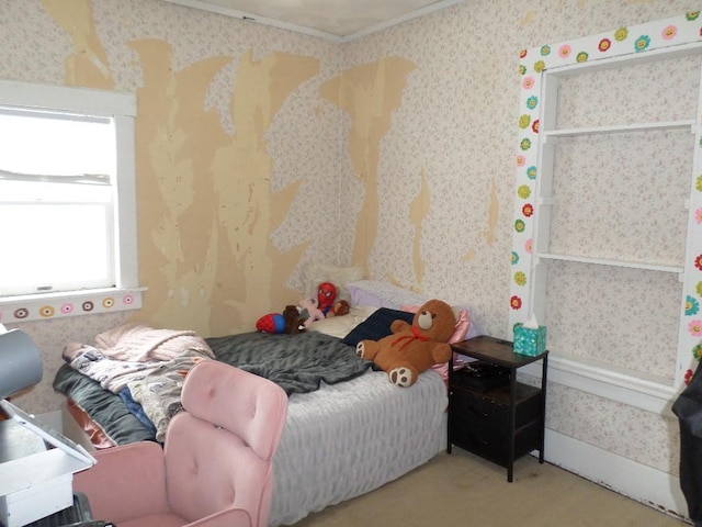 bedroom with carpet floors, ornamental molding, and wallpapered walls