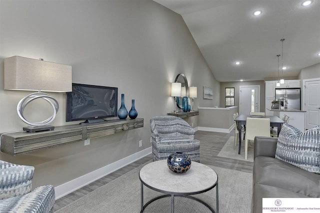 living room with dark hardwood / wood-style flooring and vaulted ceiling