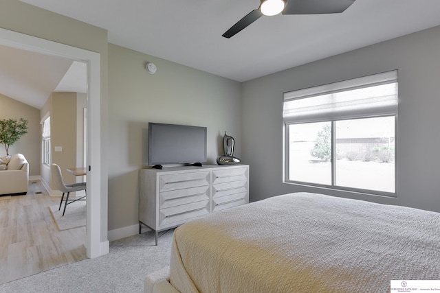 bedroom with light carpet and ceiling fan