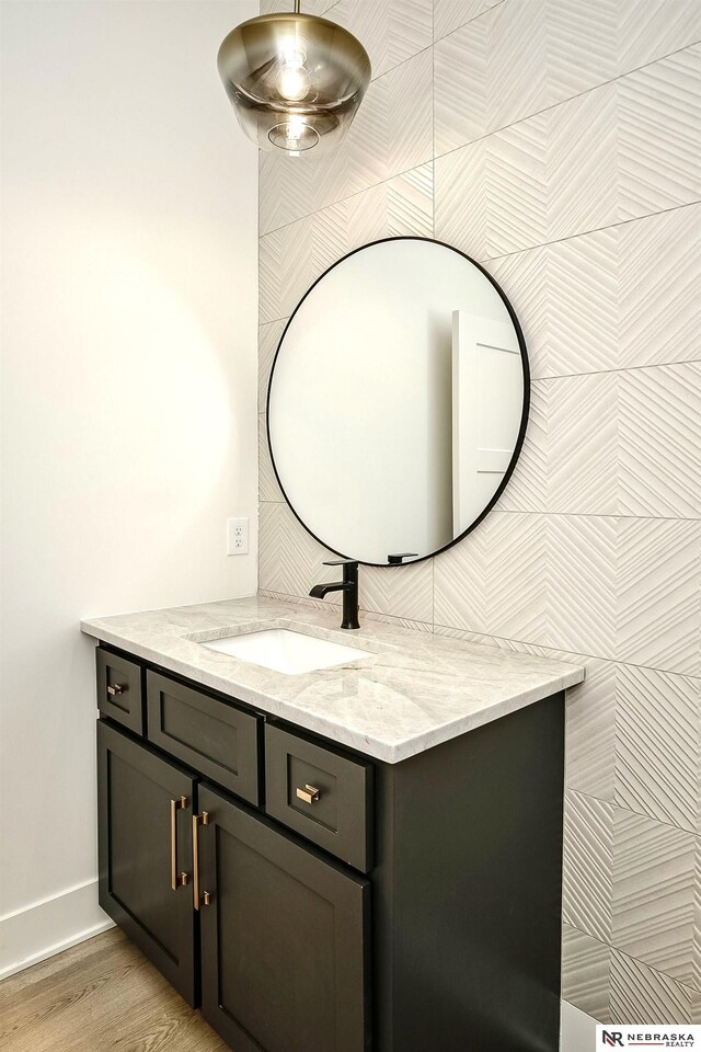 bathroom featuring hardwood / wood-style floors and vanity