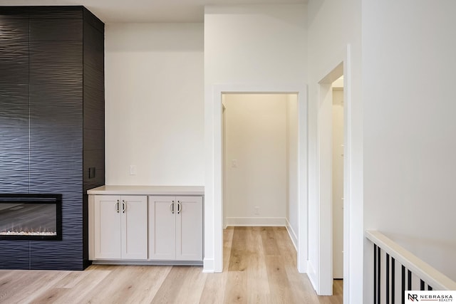 hall with light hardwood / wood-style floors