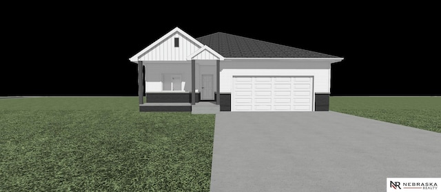 view of front of property with a garage and a front yard