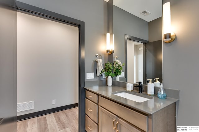 bathroom featuring vanity and hardwood / wood-style floors