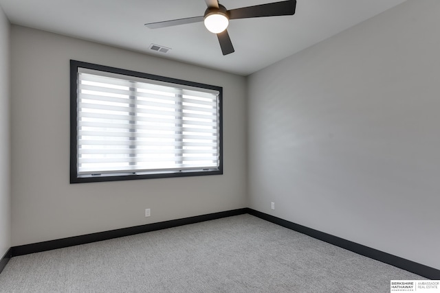 carpeted empty room with ceiling fan