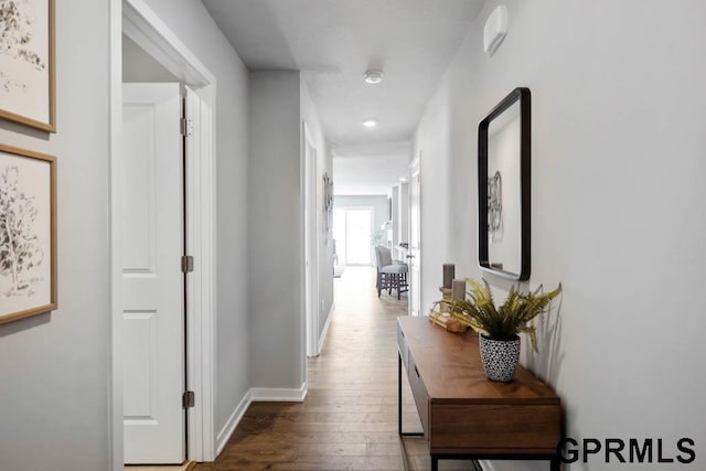 corridor with dark wood-type flooring