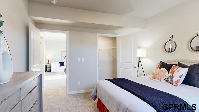 bedroom with light colored carpet and a closet