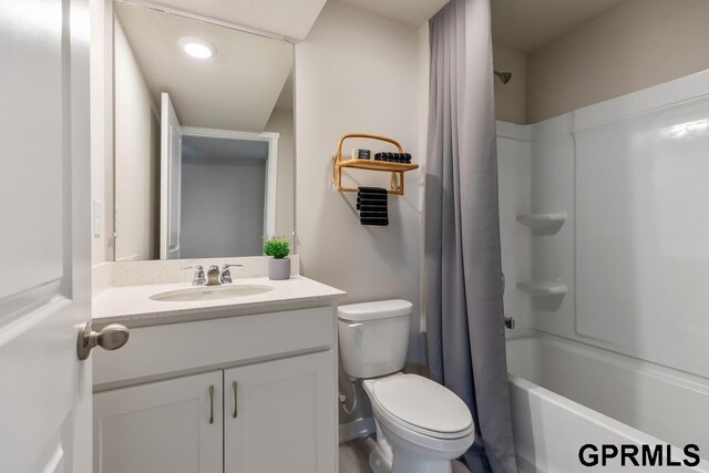 full bathroom with toilet, shower / tub combo with curtain, and large vanity