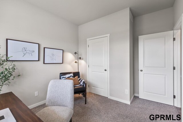 home office featuring dark colored carpet