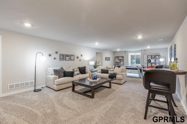 living room with light colored carpet and billiards