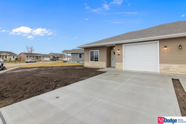 ranch-style home with a garage