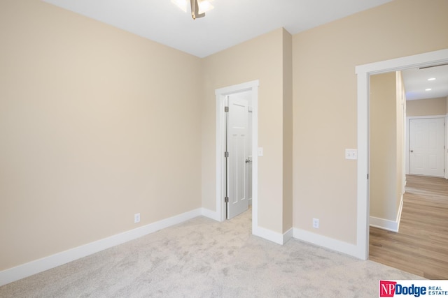 unfurnished bedroom with light carpet