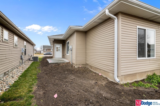 view of property exterior featuring central AC