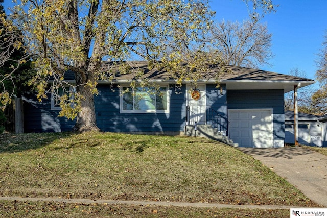 view of front of house featuring a garage and a front lawn