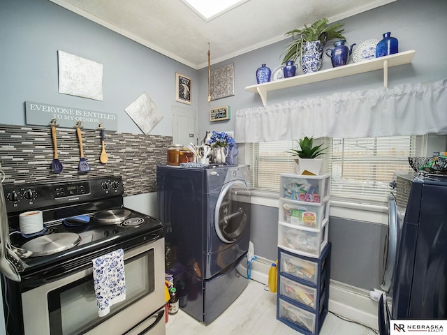 clothes washing area with washer / dryer, light hardwood / wood-style flooring, and crown molding