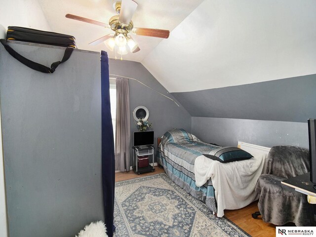 bedroom featuring lofted ceiling and ceiling fan