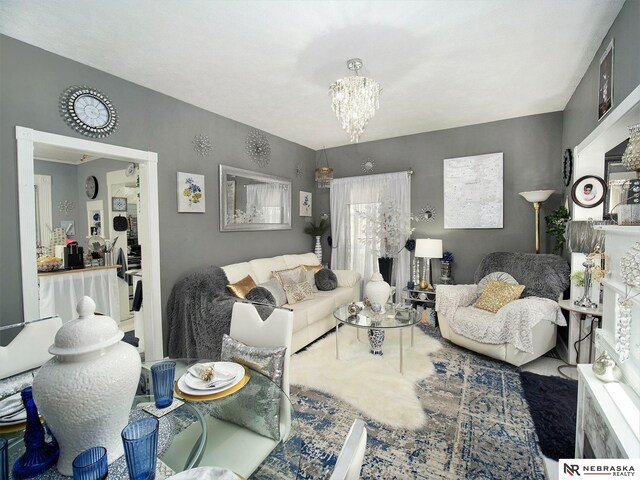 living room featuring an inviting chandelier