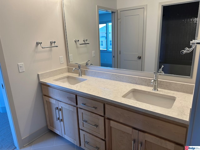 bathroom featuring tile patterned flooring and vanity