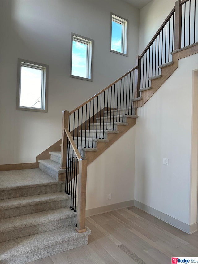 staircase featuring hardwood / wood-style floors