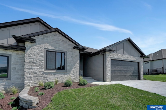 view of front of home with a garage and a front yard