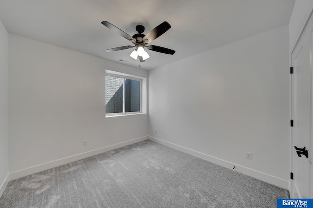 spare room featuring carpet flooring and ceiling fan