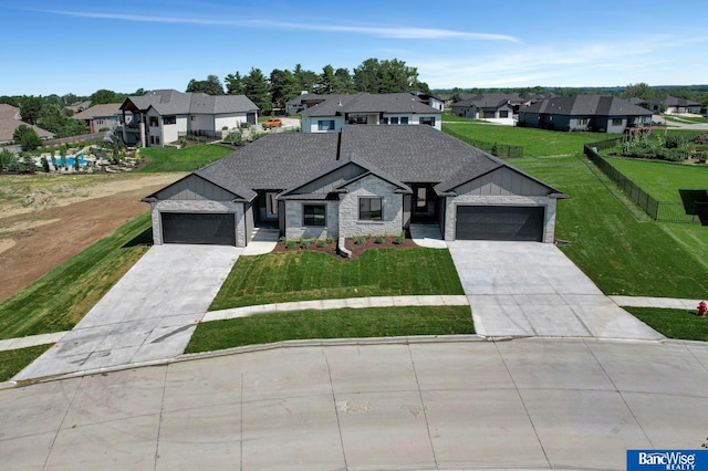 view of front of house with a garage and a front yard