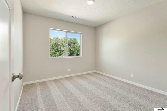 11719 S 125th St, Papillion, NE 68046 - empty room with baseboards, visible vents, carpet, and a textured ceiling