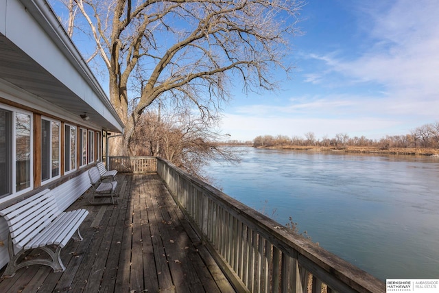 wooden deck with a water view